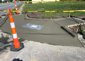 Pylons block a new concrete curb in North Carolina.