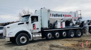 A Fulford & Jones, Inc. volumetric mixer is parked on a worksite in Kinston, NC.